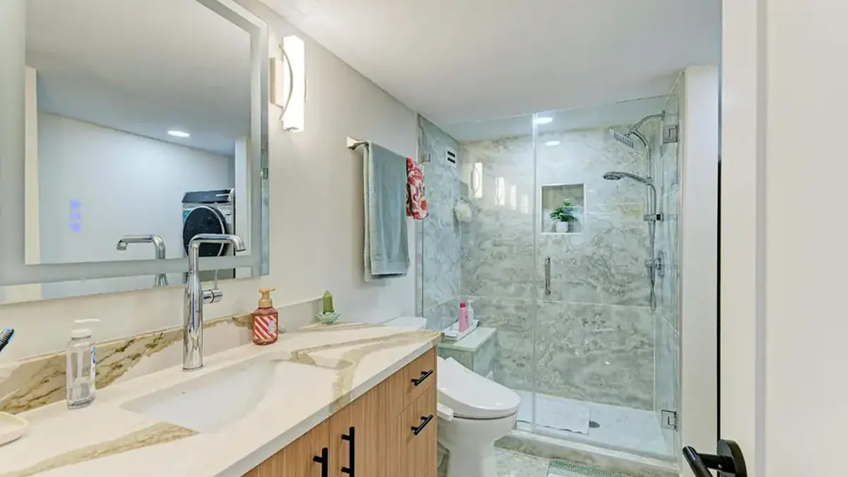 Remodeled bathroom with tiled walk-in shower