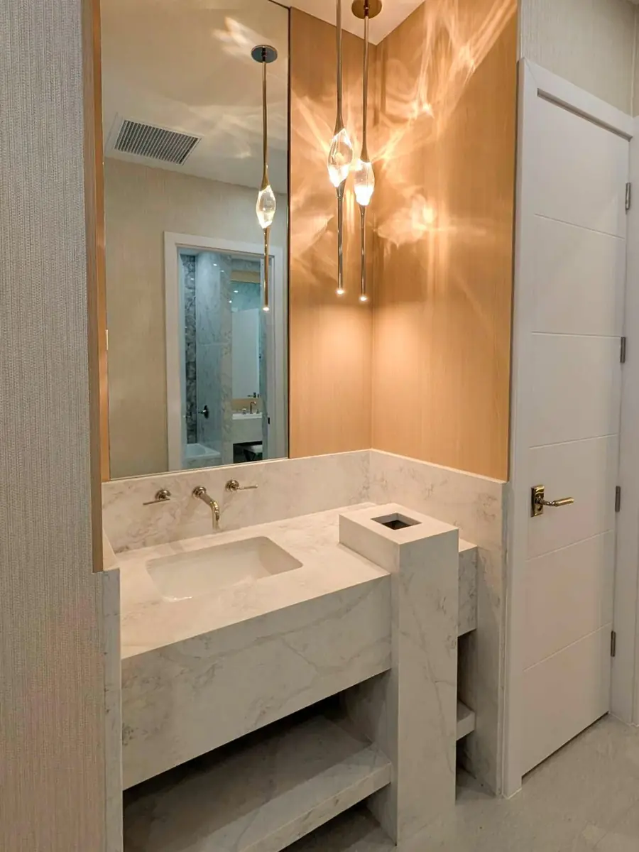 Finished bathroom vanity with pendant lighting, built by our team