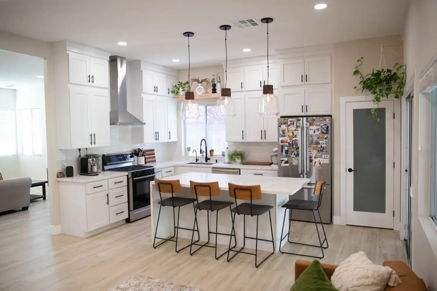 Bright kitchen after a full remodel with white cabinets