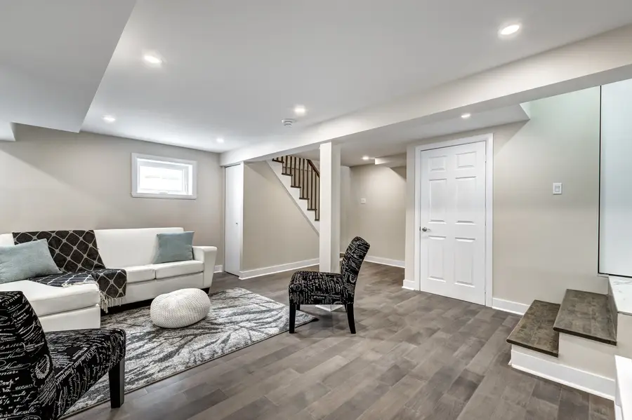 Finished basement family room with stairs